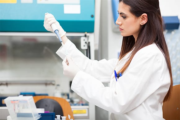 Medical professional reviewing localized clinical trial materials and clinical research in her native language