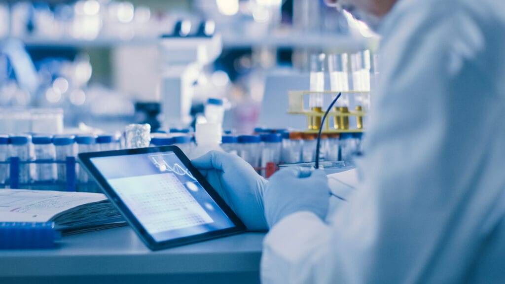 Scientest looking at medical data on tablet localized into their native language